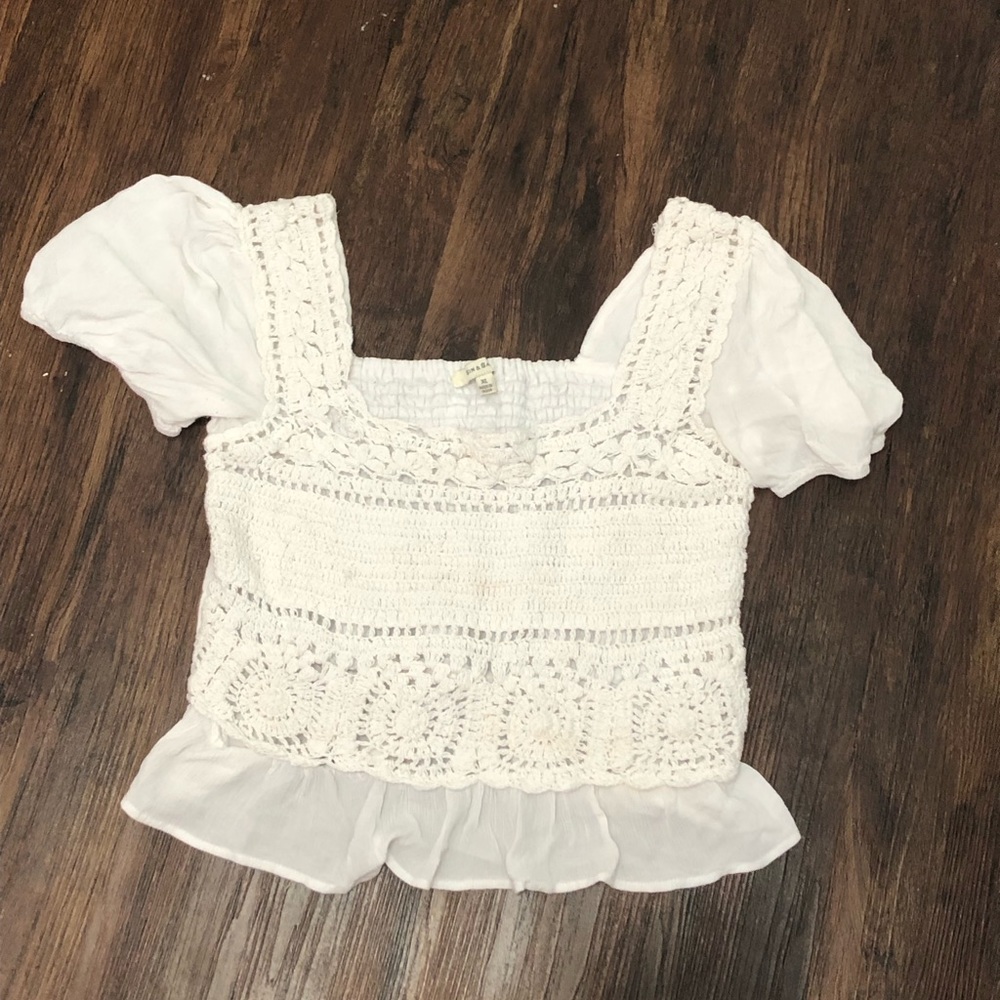 White flowy shirt with ruffles and puff sleeves